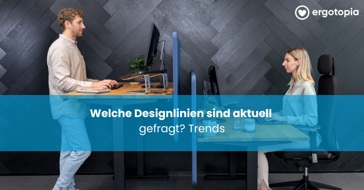 Kollege und Kollegin arbeiten sich gegenüber an getrennten Schreibtischen mit Sichtschutzwand